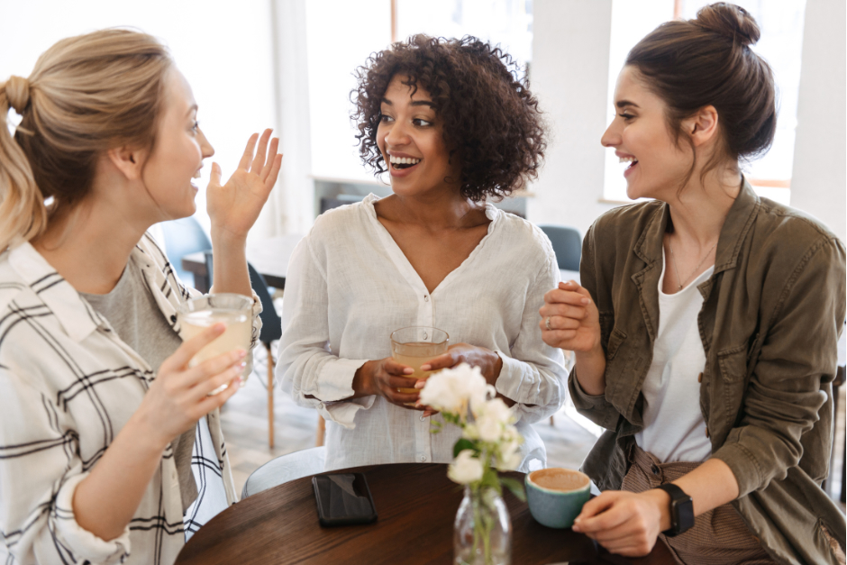 Three young women in their 20s and 30s discussing the importance of regular health screenings.