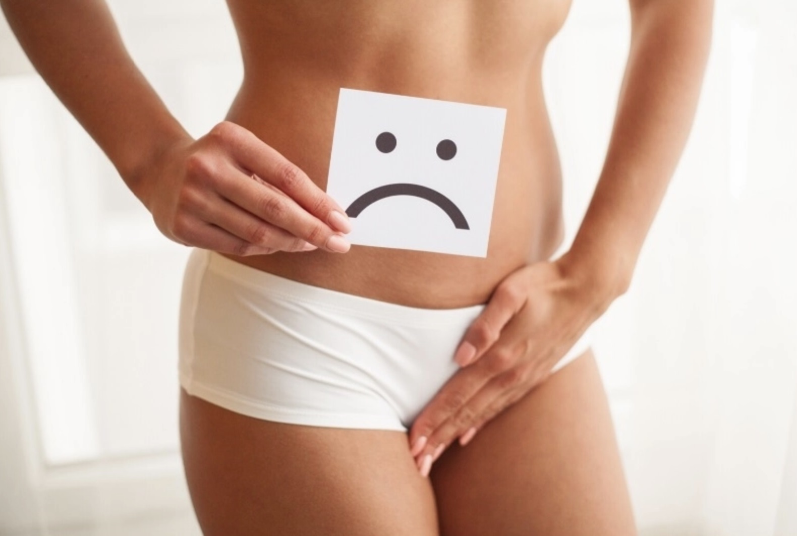 A woman's torso showing a sad face indicating problems with urinary incontinence and a card seeking help.