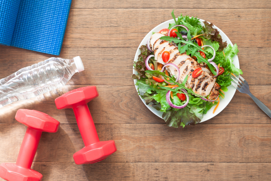 Healthy meal, water, dumbbells and a yoga mat all contribute to good heart health for women.