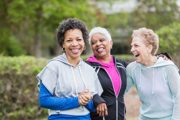 Three fit and healthy smiling older women